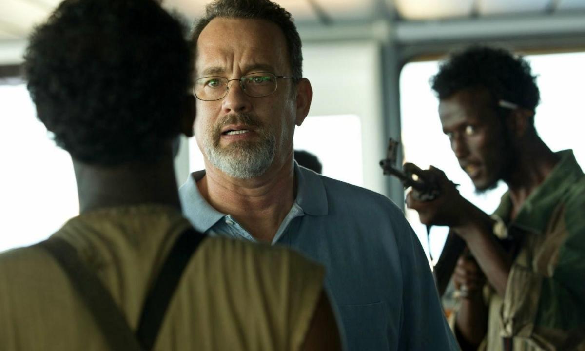 Two pirates confronting Captain Richard Phillips in the film Captain Phillips.