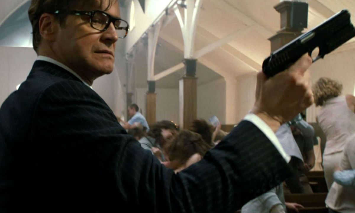 Colin Firth holds a gun in Kingsman.