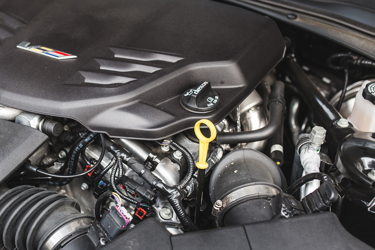 how to change the oil in your car 2017 cadillac ats v cap and dipstick