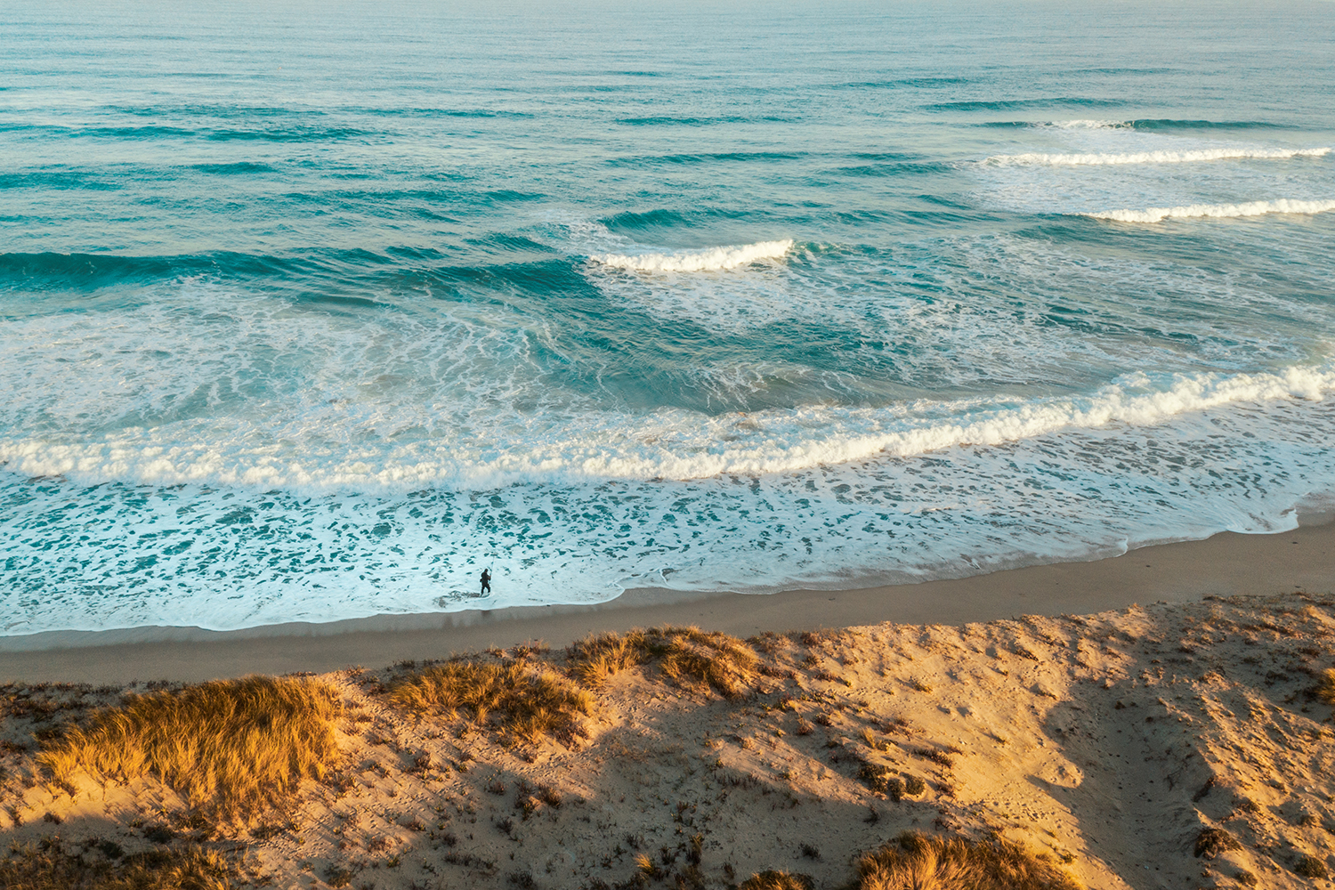 best drone photos man on beach
