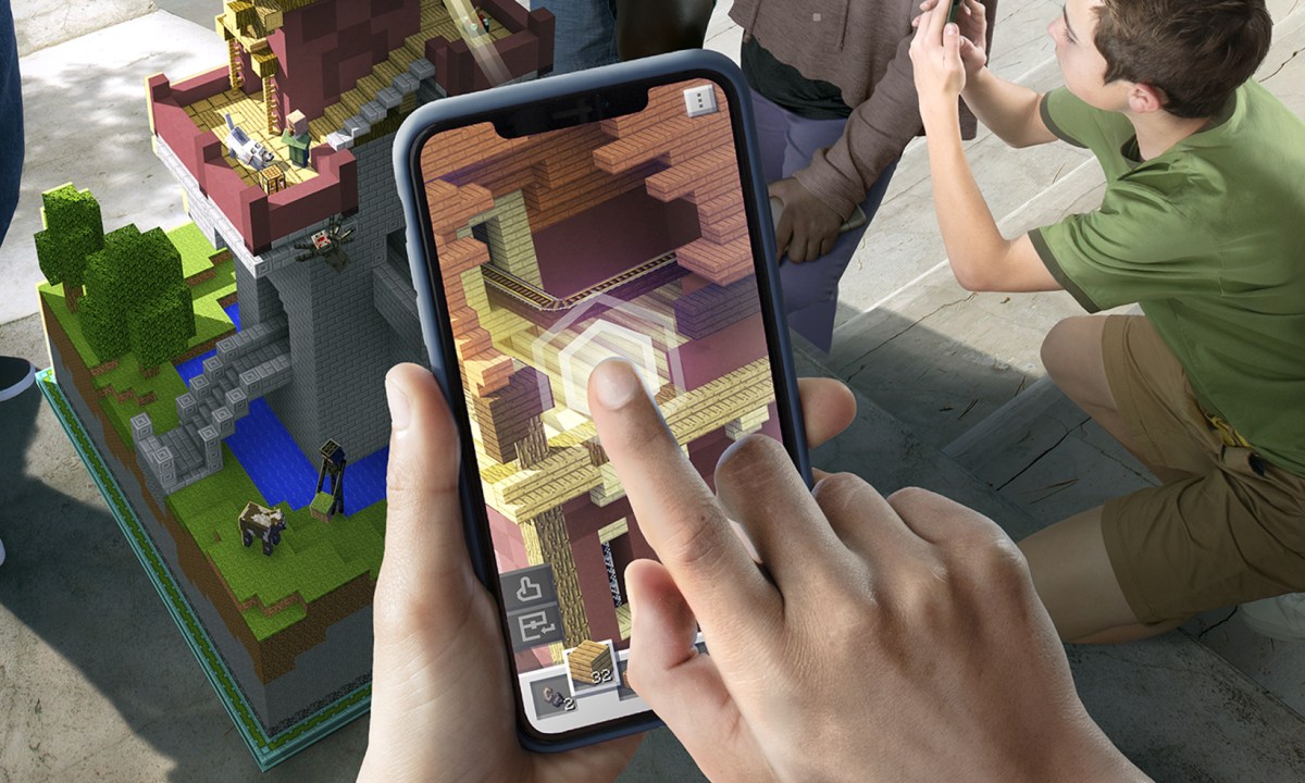 Playing Minecraft Earth on a phone (key art)