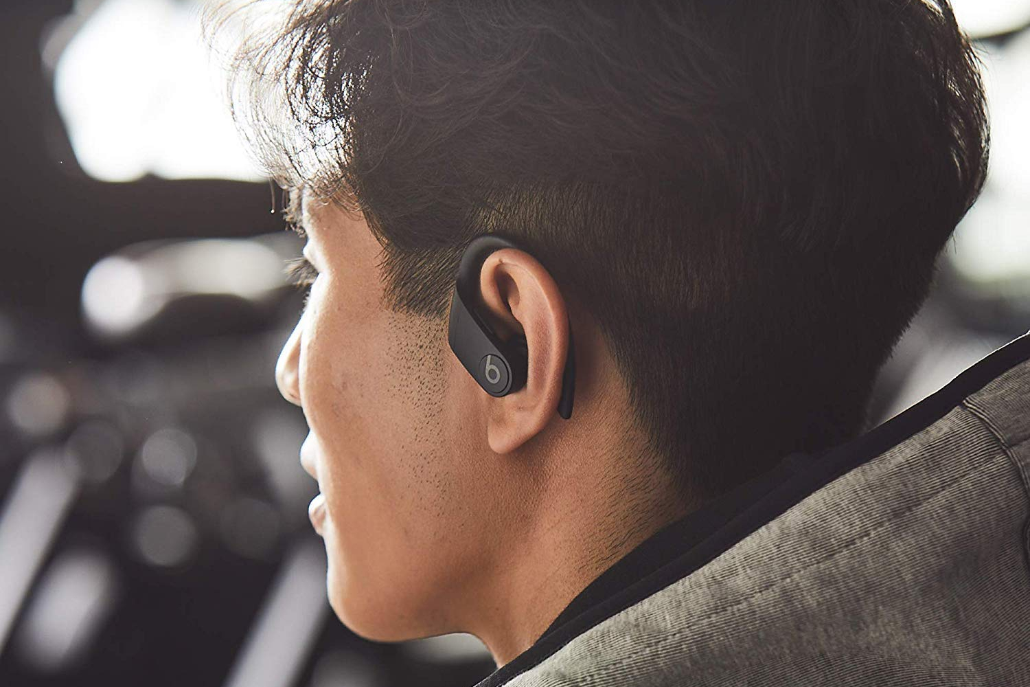 A person wearing the Beats Powerbeats Pro.