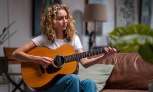 Woman playing the guitar