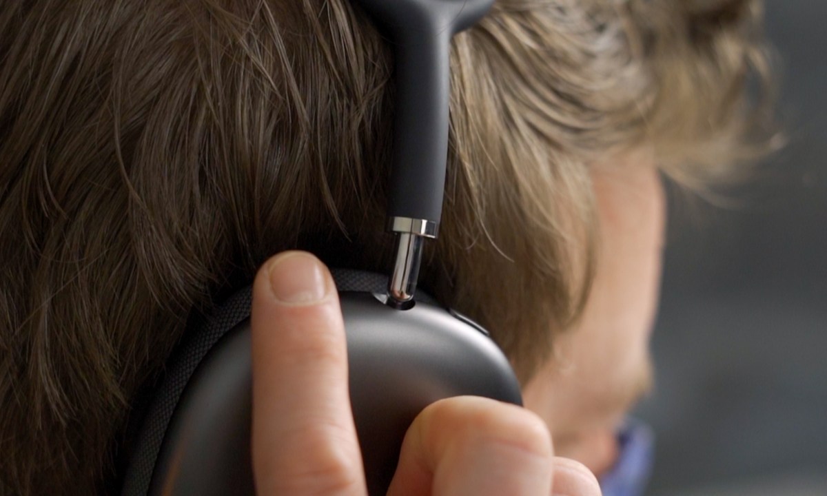 A person listening to the Apple AirPods Max.