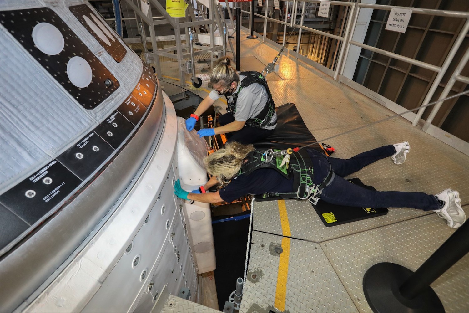 Engineers working on Boeing's Starliner spacecraft.