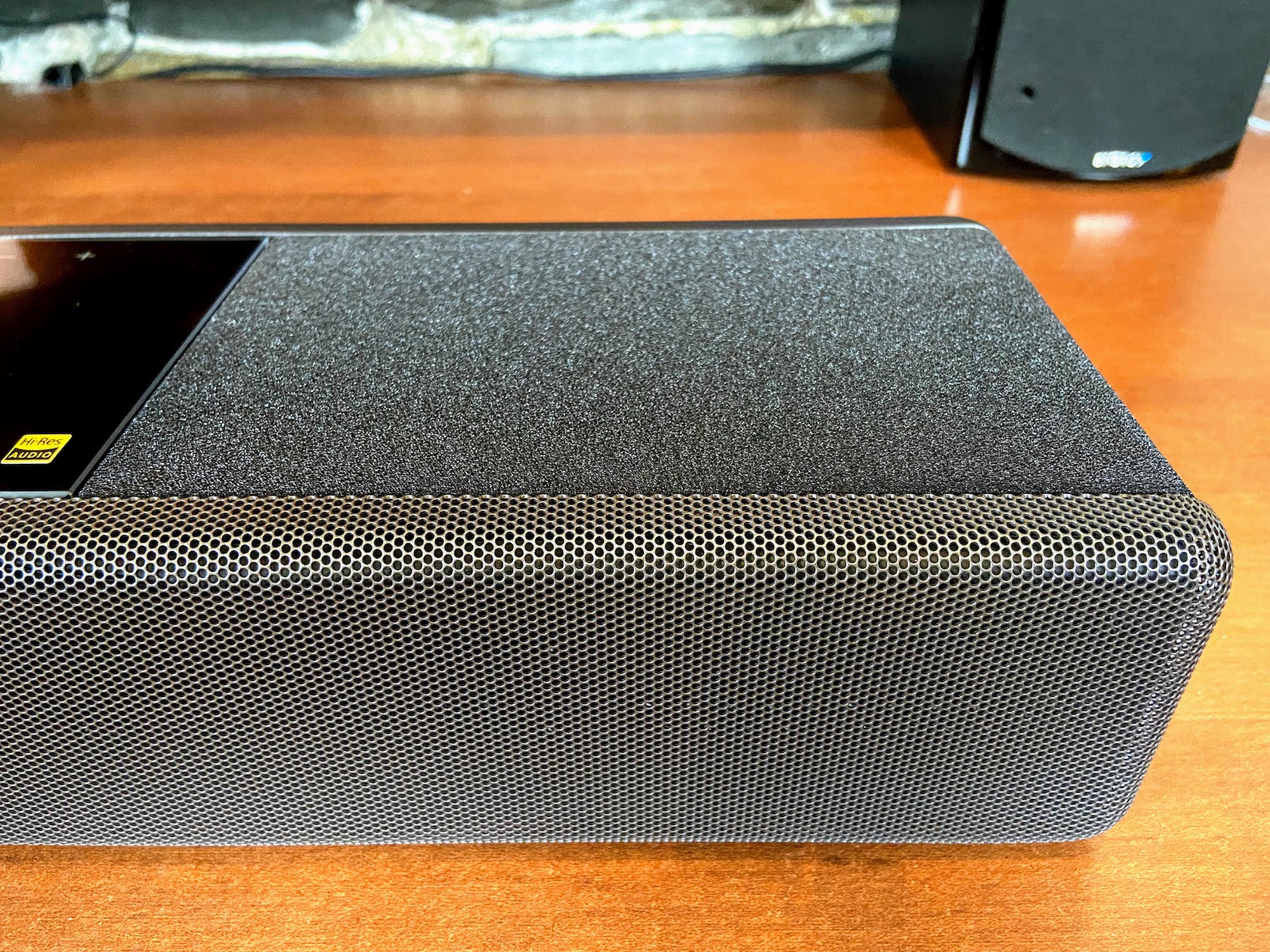 Sony HT-A7000 Dolby Atmos soundbar close-up of top speaker.