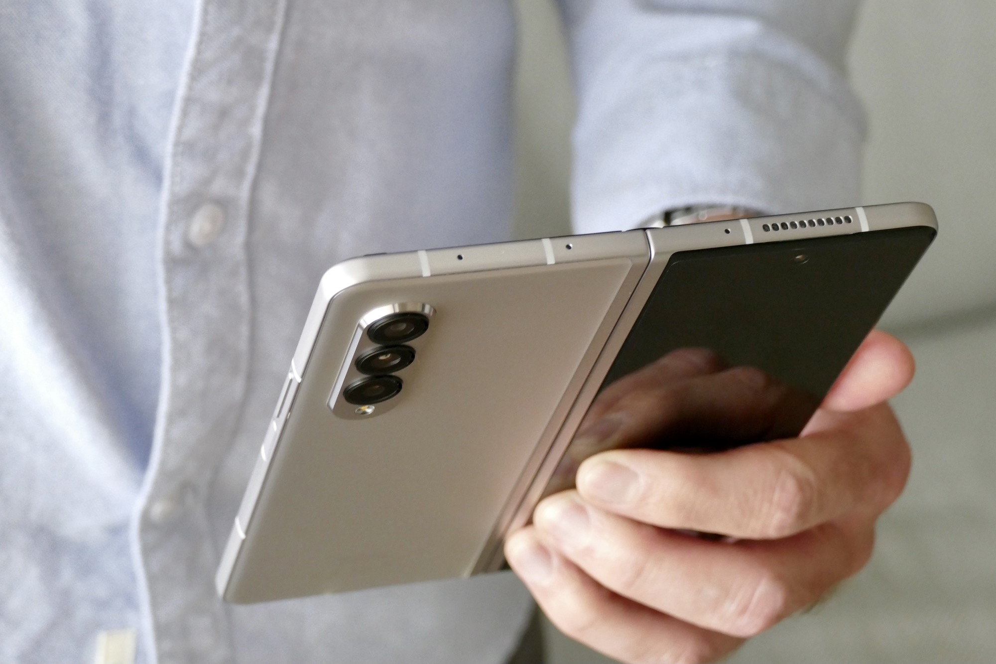 Open Galaxy Z Fold 3 held in one hand.