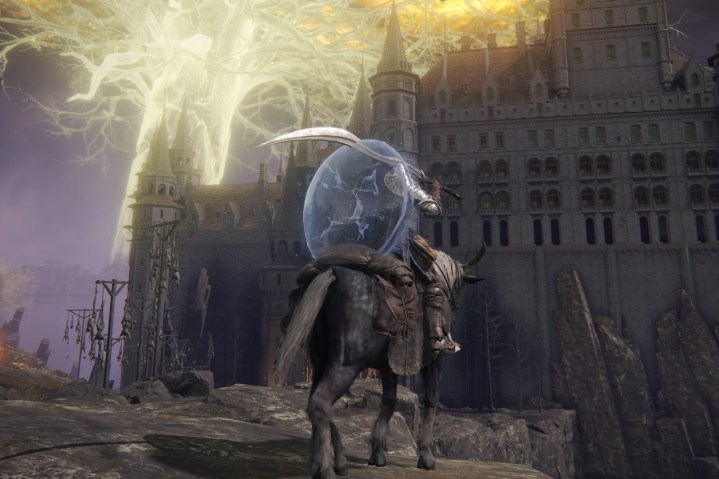 An Elden Ring player sits on their horse and looks out at a castle ahead.