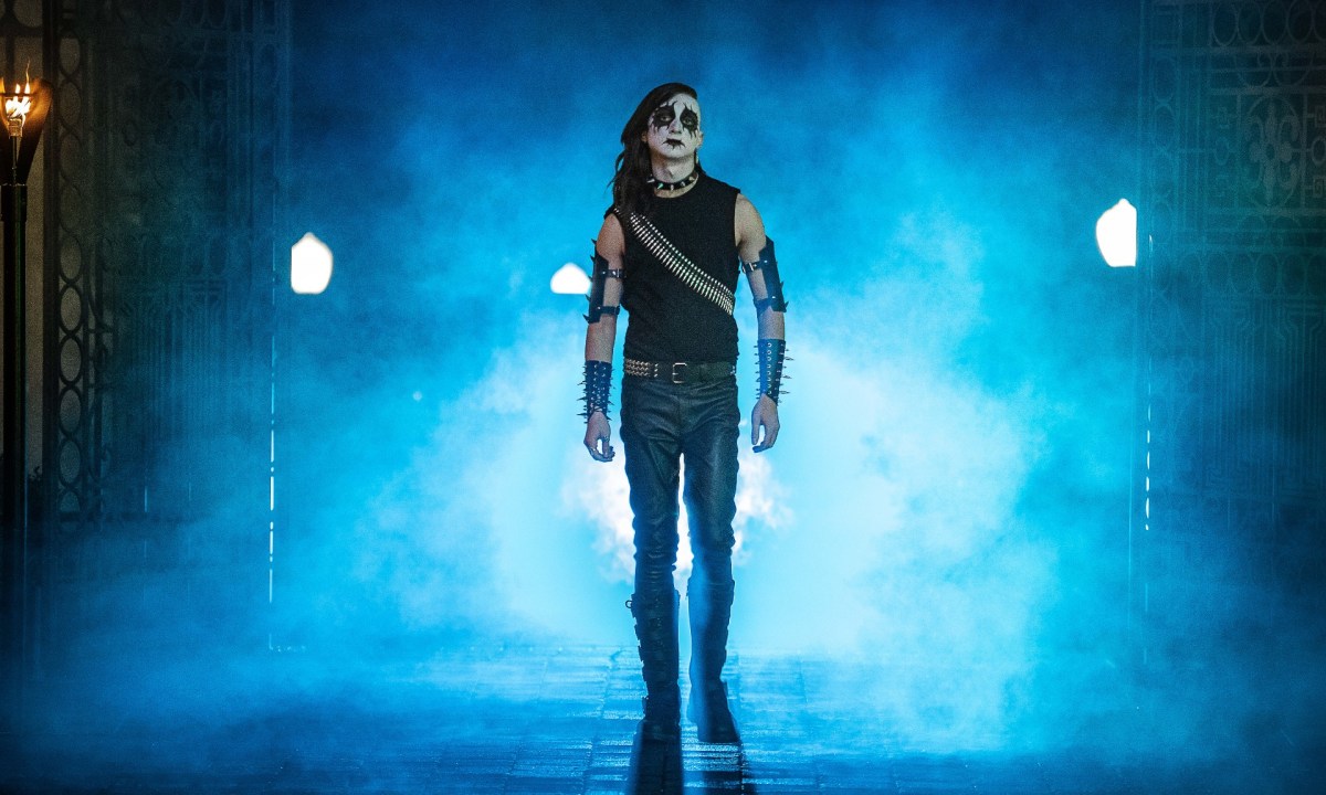 Aidan Greensmith walks out of the mist in heavy-metal leather and makeup in a scene from Metal Lords.