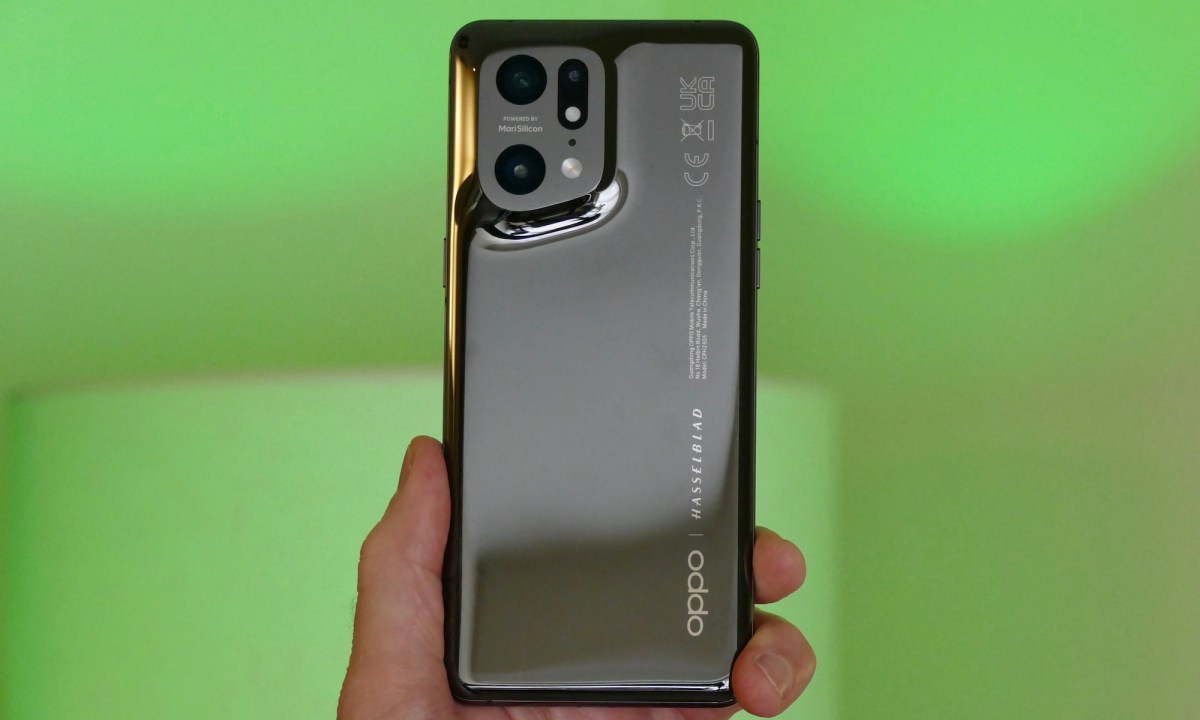 Oppo Find X5 Pro held in hand seen from the back.