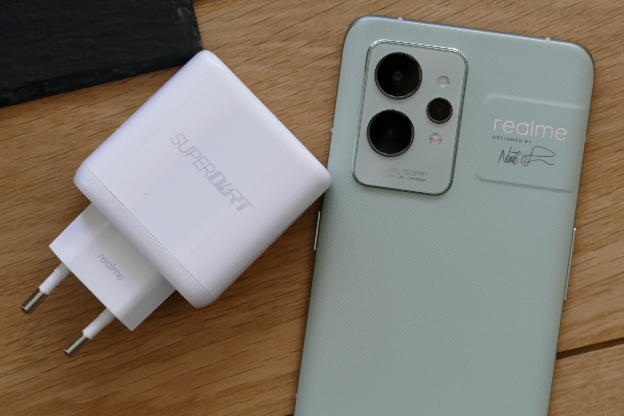 Realme GT 2 Pro's camera module and SuperDart charger.