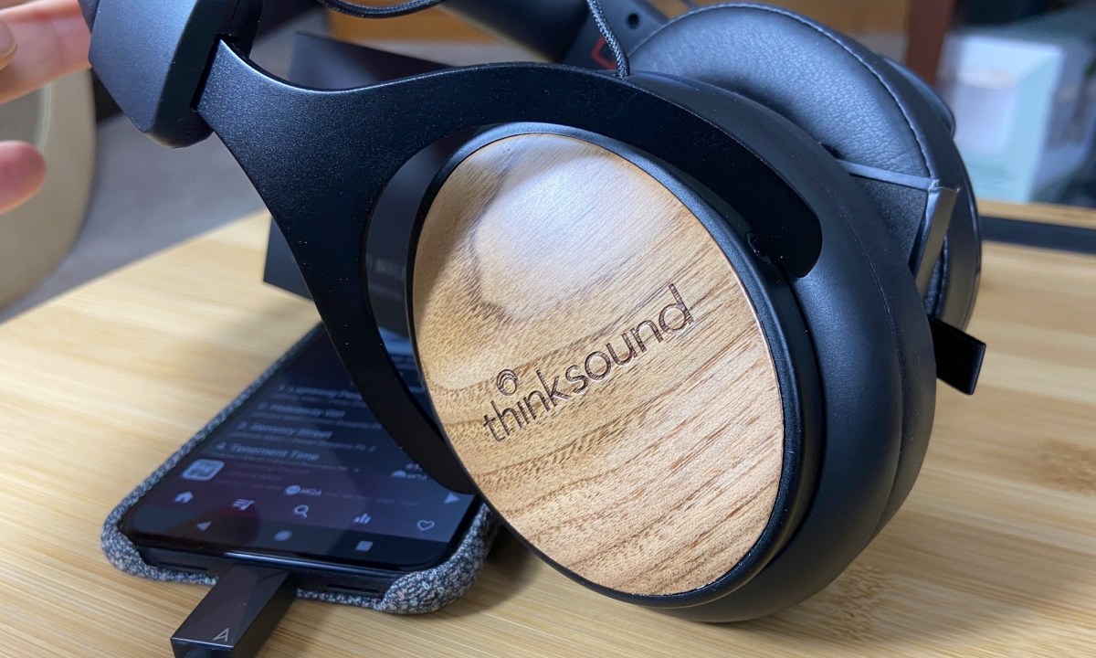 Close-up of Thinksound OV21 wired headphones' walnut cover.
