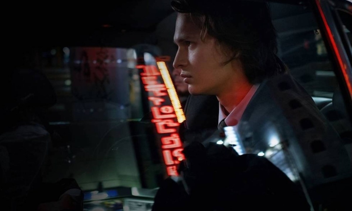 Ansel Elgort rides in a car in a scene from Tokyo Vice.