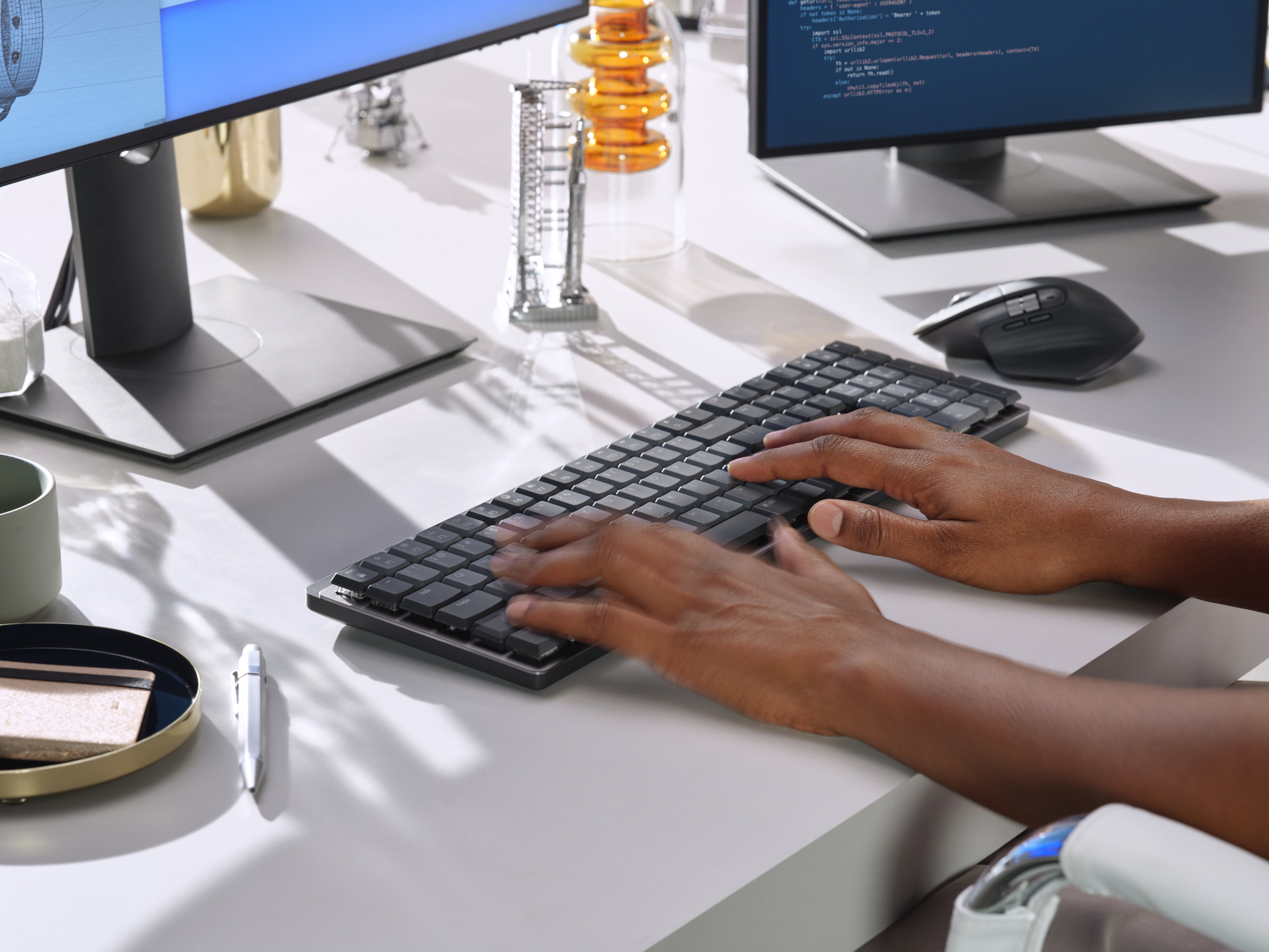 Person using MX Mechanical keyboard from bottom left corner.