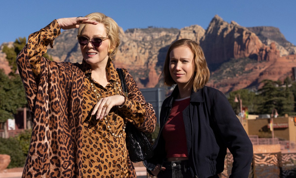 Jean Smart wears a cheetah print shirt while standing next to Hannah Einbinder in Hacks Season 2.