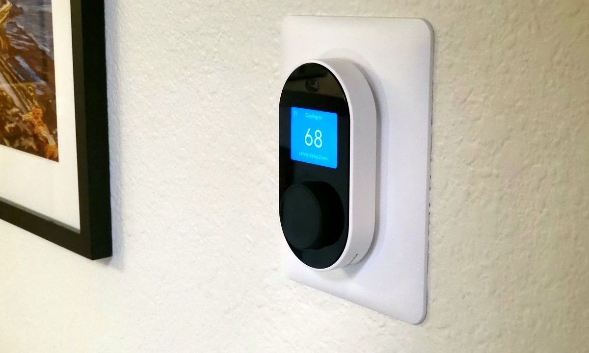 Wyze Thermostat installed on a white wall.