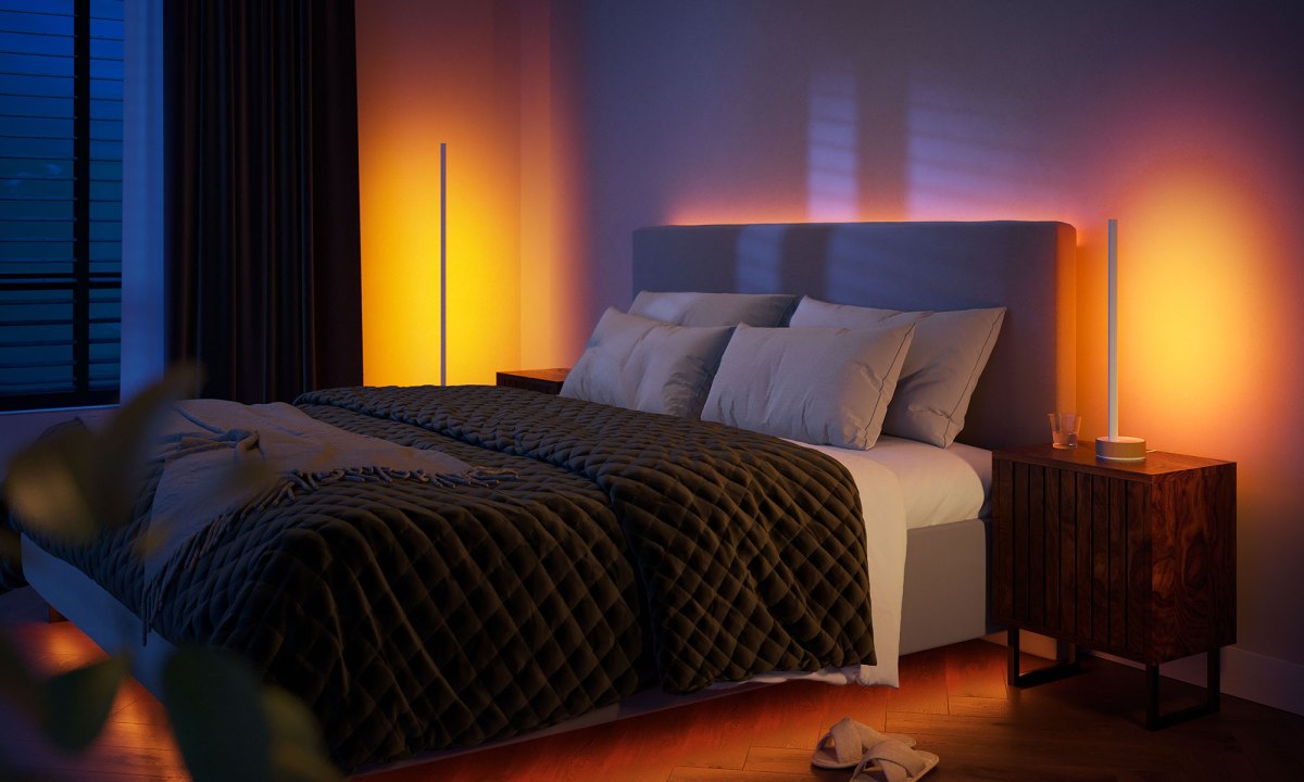 Philips Hue Signe lamps with oak finish set up in bedroom.