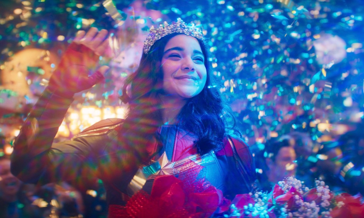 Kamala Khan, played by Iman Vellani, imagines confetti and a party around her in a scene from Ms. Marvel.