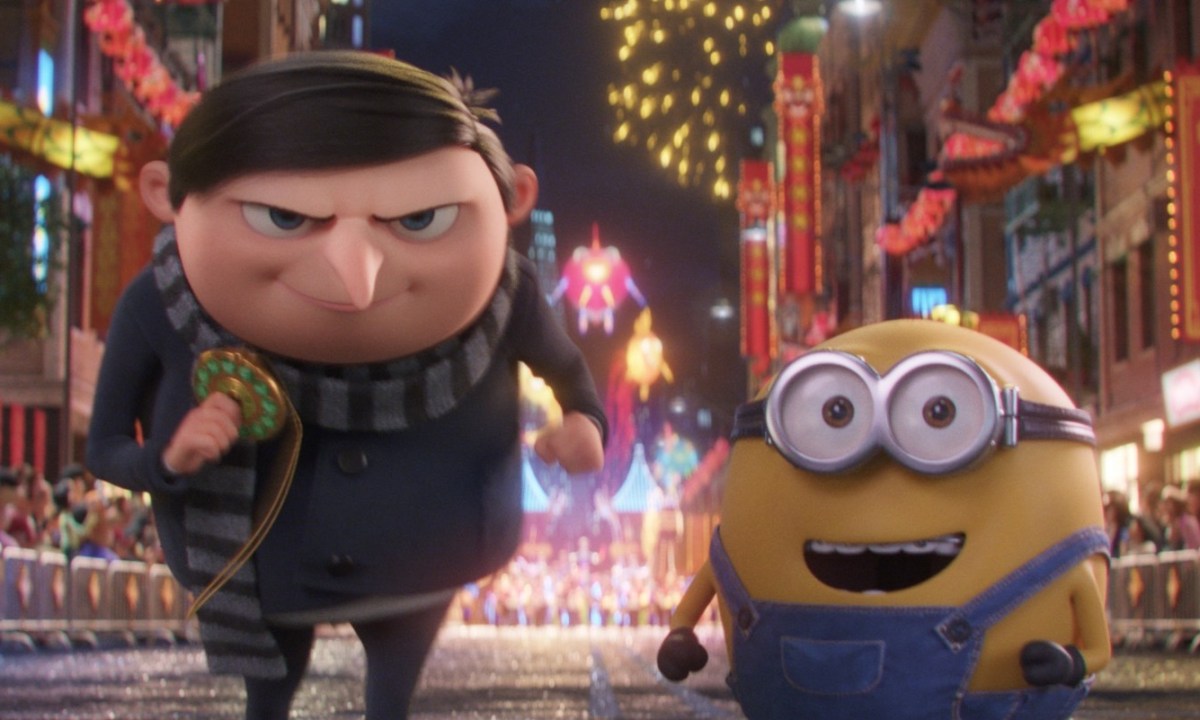 Gru and a Minion march through San Francisco's Chinatown toward the camera.