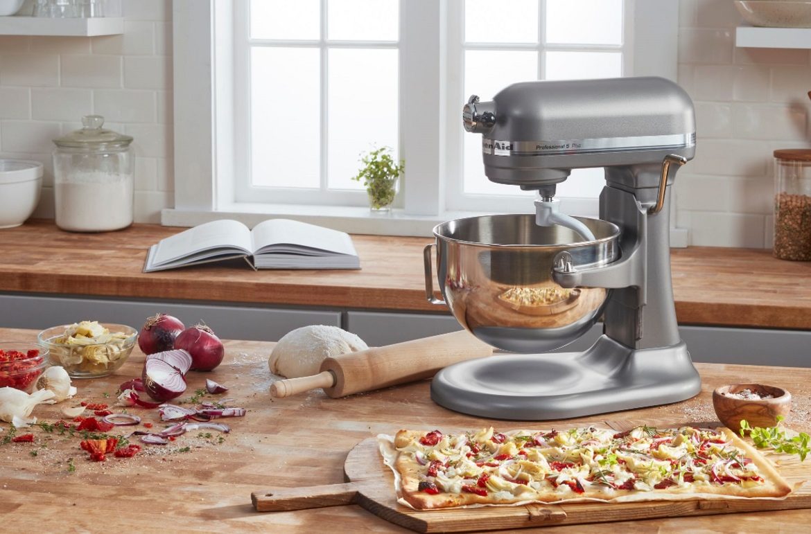 The KitchenAid Pro 5 Plus stand mixer on a kitchen table.