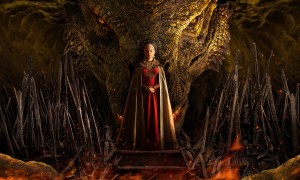 Young Princess Rhaenyra with her dragon Syrax looming behind her in "House of the Dragon."