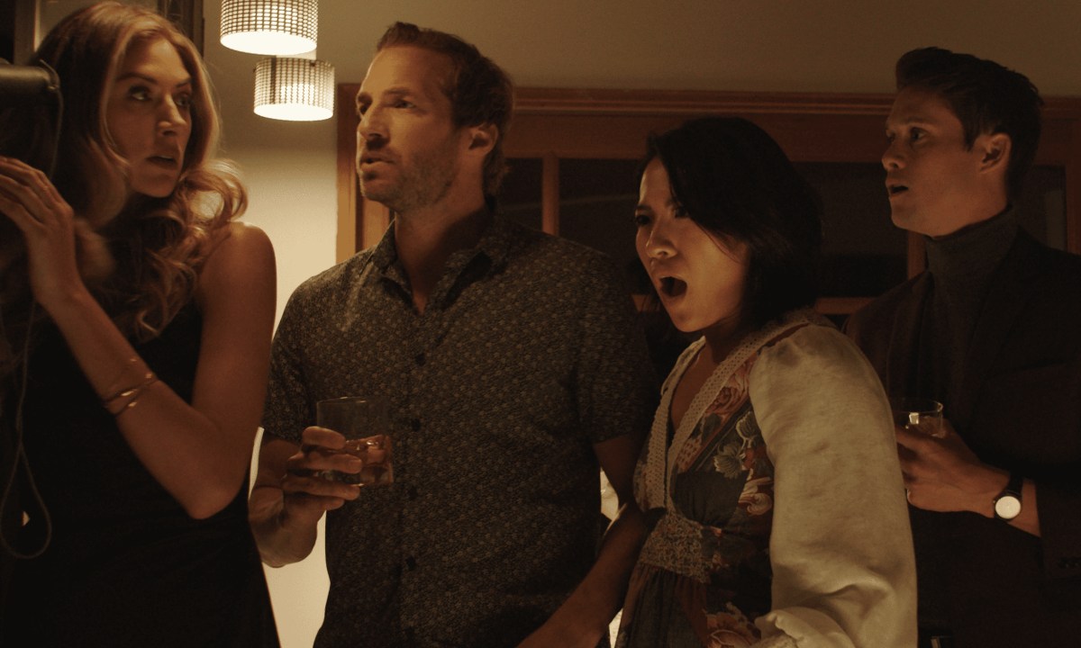 Sasha, Adam, Margo, and Tom stand grouped together in Who Invited Them.
