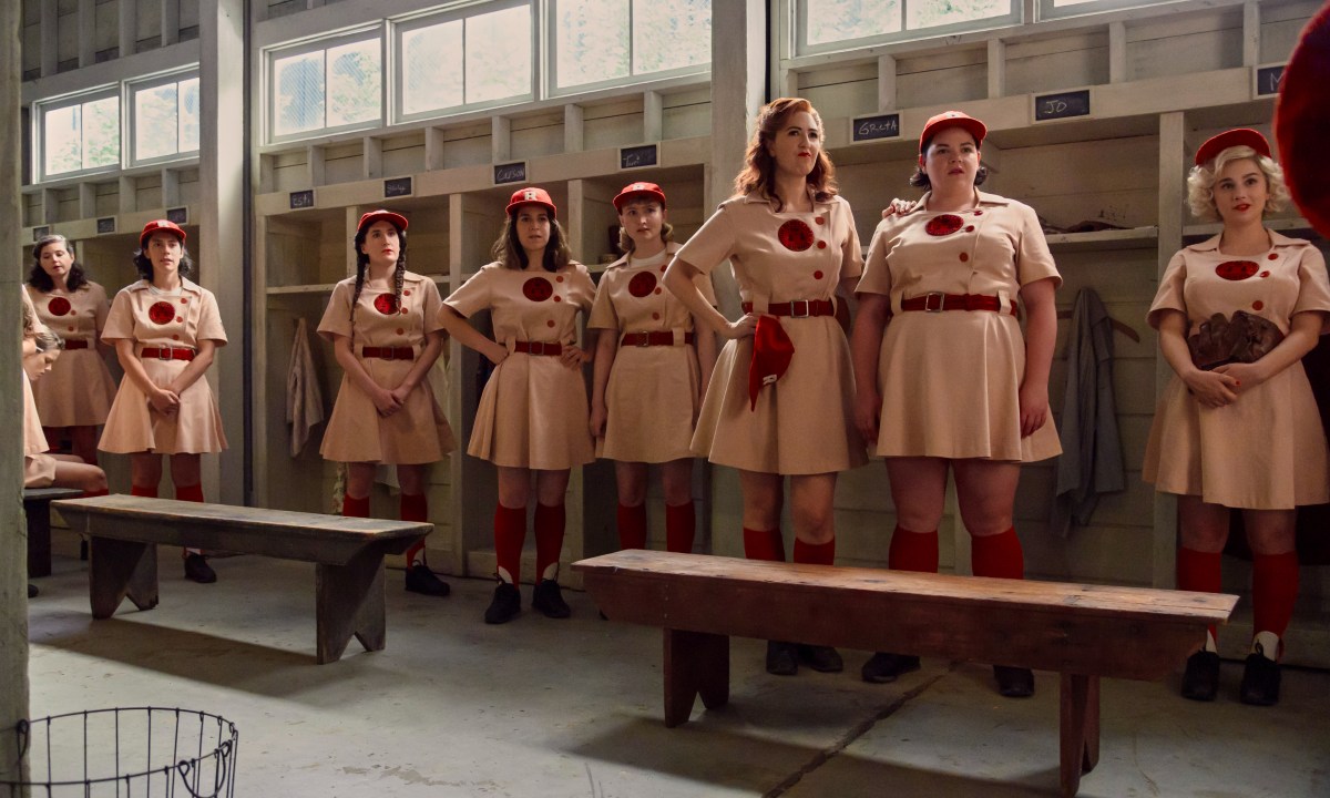 The Rockford Peaches stand together in their locker room in Amazon's A League of Their Own.