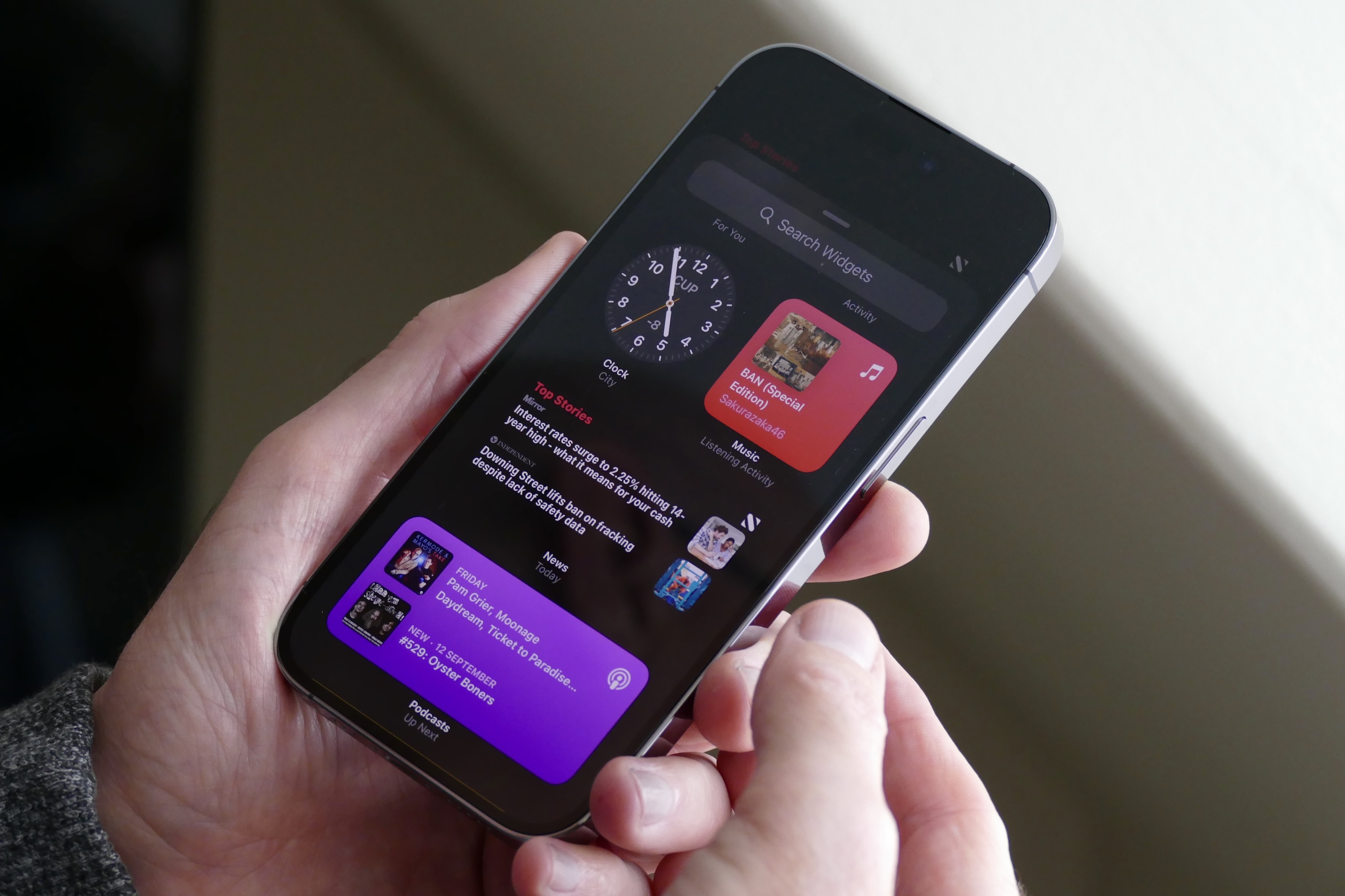 iPhone 14 Pro showing widgets.