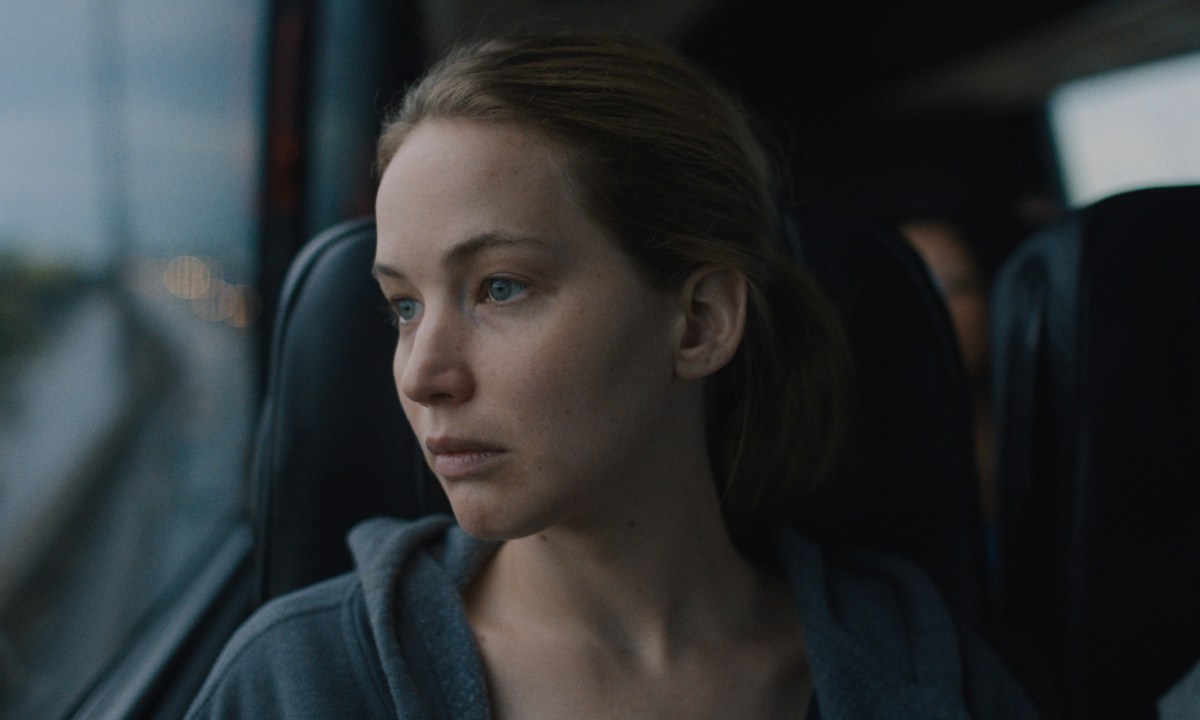 causeway review jennifer lawrence looking out a bus window in