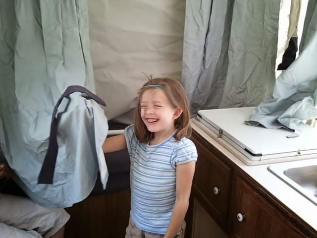 Photo of a smiling young girl.