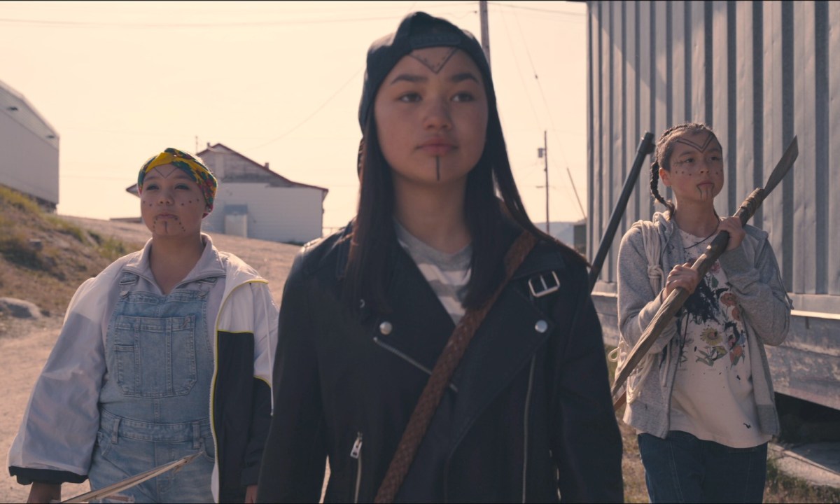 Three girls, each armed with different weapons, go looking for alien invaders in a scene from Slash/Back.