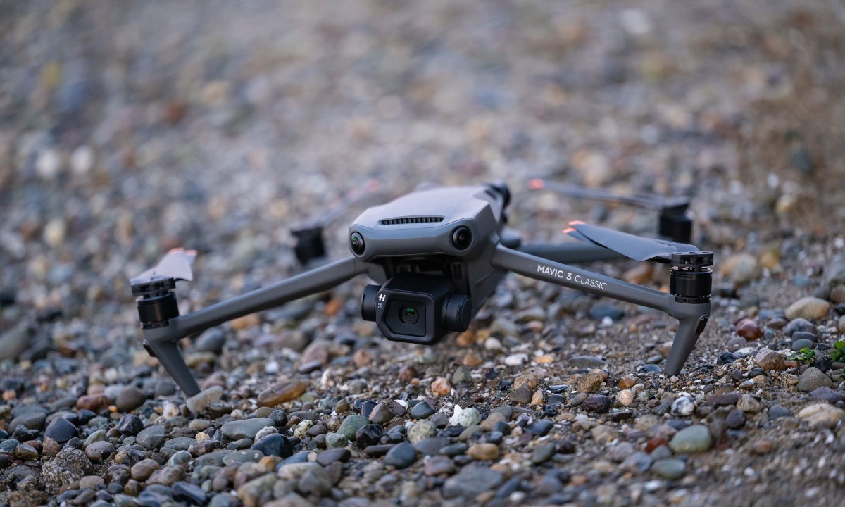 The DJI Mavic 3 Classic on a rocky beach.