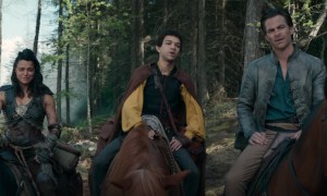 Three people sit on horses and stare in a scene from Dungeons & Dragons.