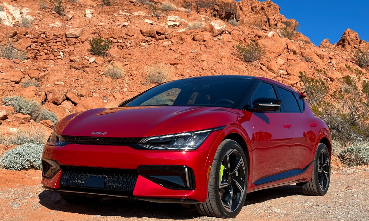 Front three-quarters view of a 2023 Kia EV6 GT in a desert setting.