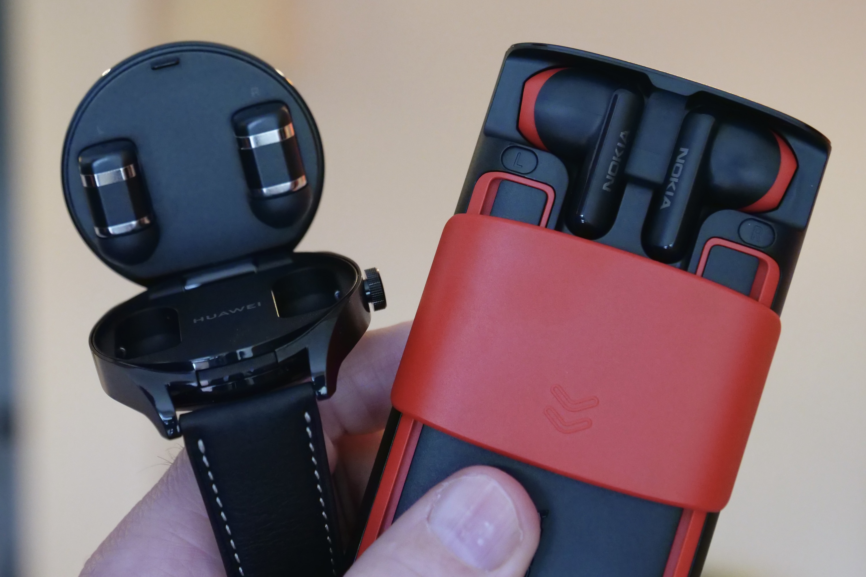The open Nokia 5710 XpressAudio and Huawei Watch Buds