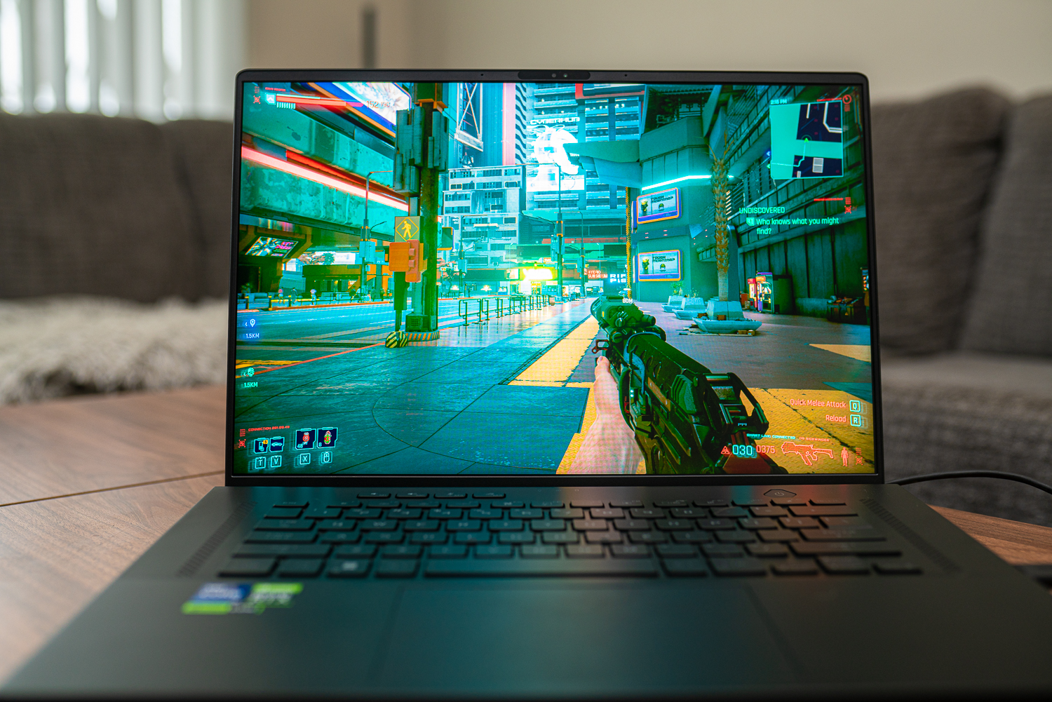 Asus ROG Zephyrus M16 placed on a desk.