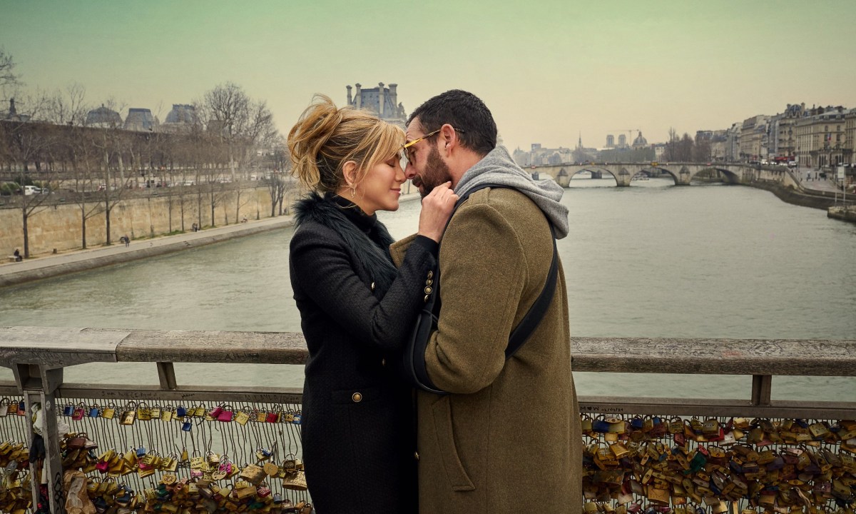A man and a woman embrace in Murder Mystery 2.