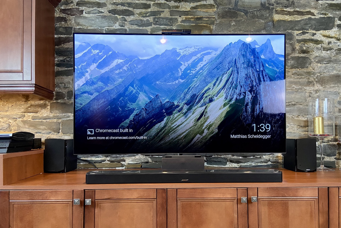 A Bose Smart Soundbar 900 under a television on a countertop.