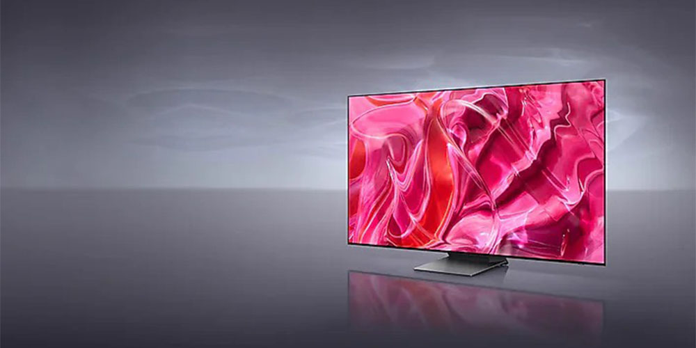 The Samsung S90C on a gray background.