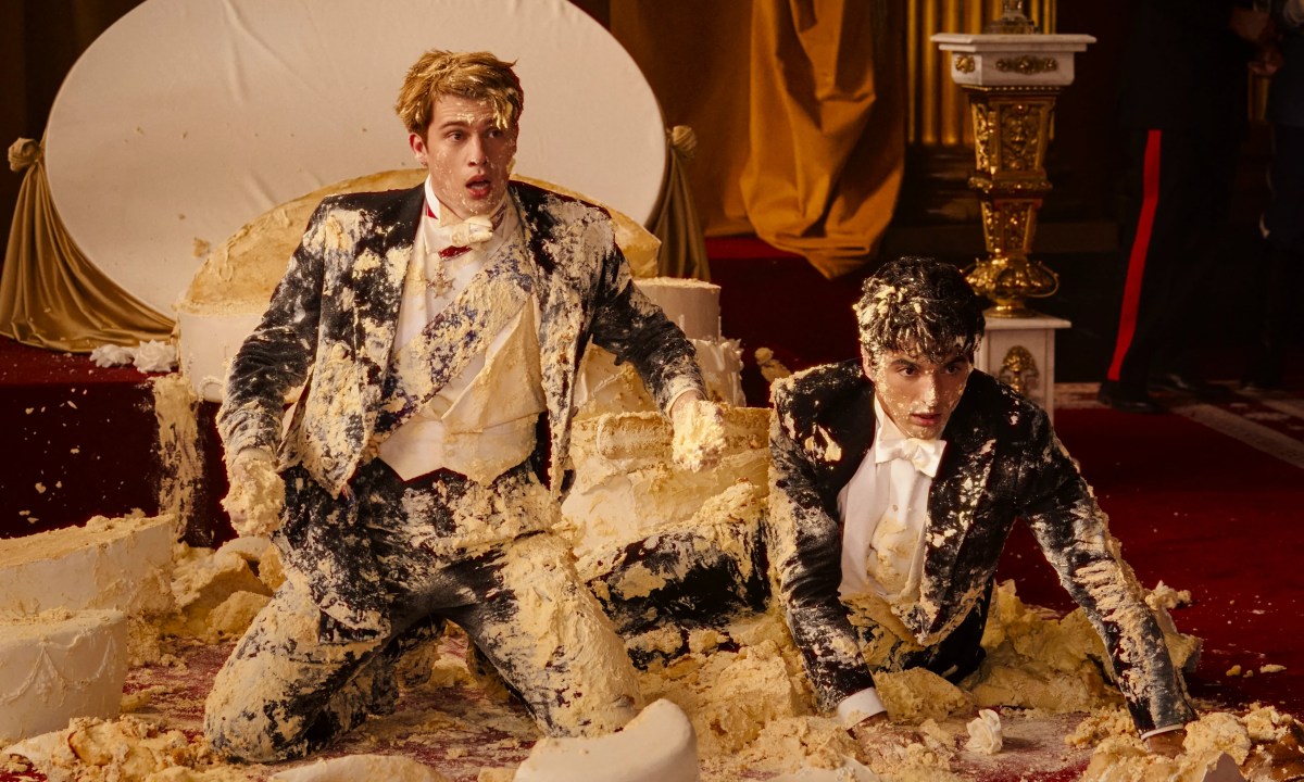 Two men are covered in cake in Red, White & Royal Blue.