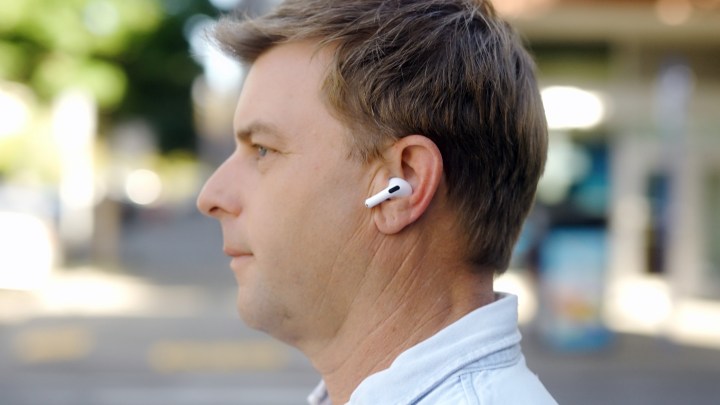 Profile of a man wearing the Apple AirPods Pro 2 with USB-C and MagSafe case.