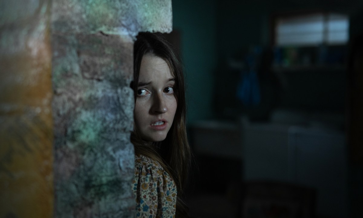 Kaitlyn Dever hides in a basement in No One Will Save You.