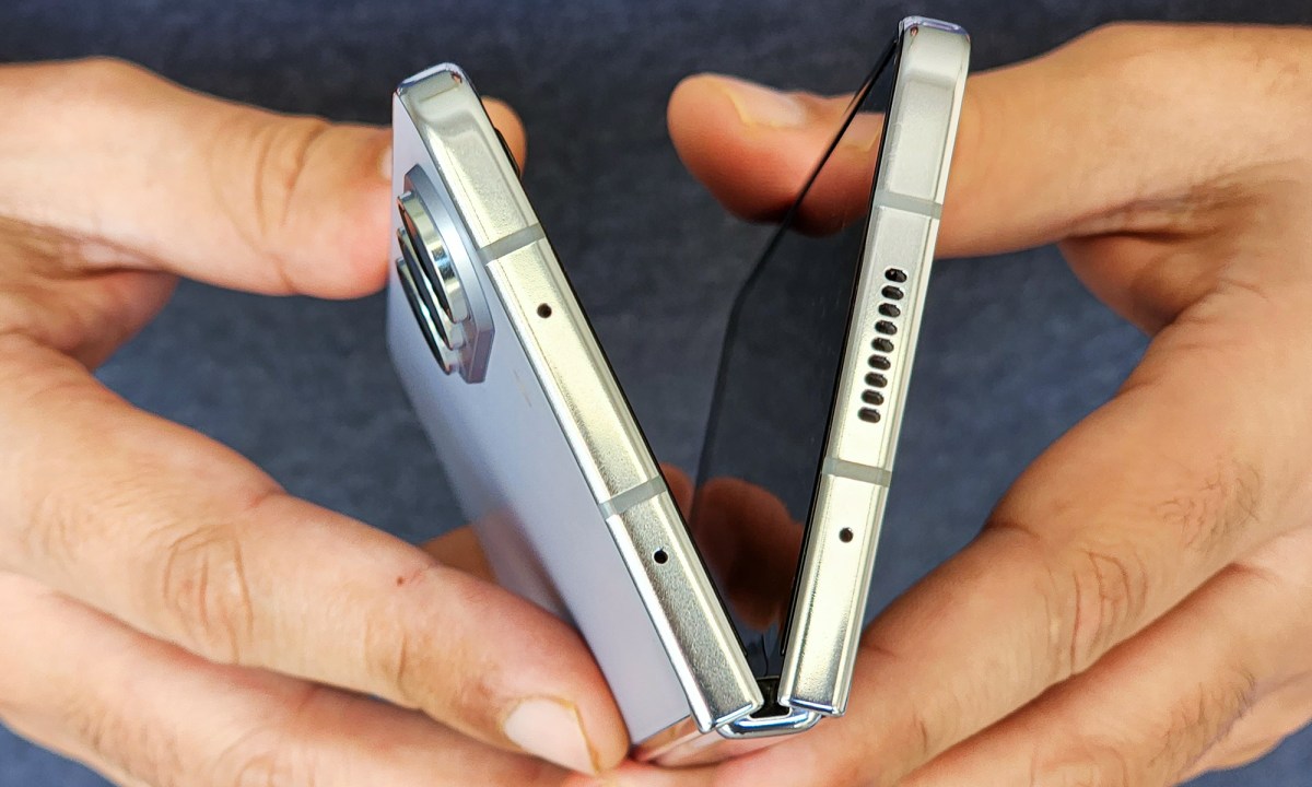 Someone opening the Samsung Galaxy Z Fold 5.