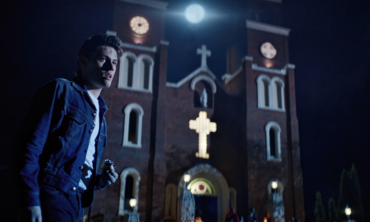 Richie stands near a church in Dark Harvest.