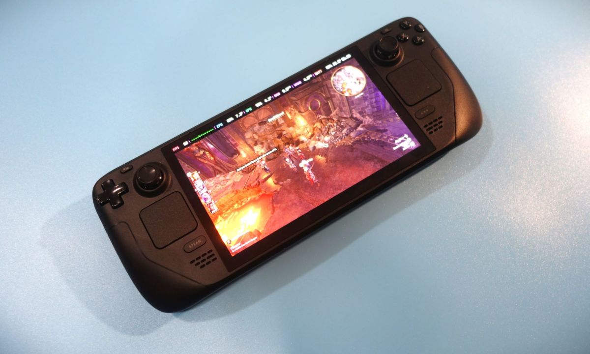 A Steam Deck OLED sits on a table.