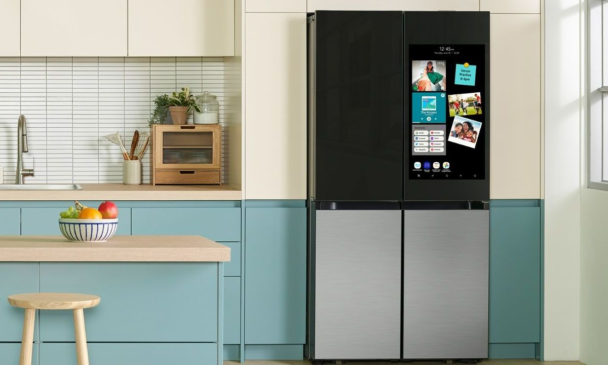 The Samsung Bespoke Smart Fridge next to white and blue cabinets.