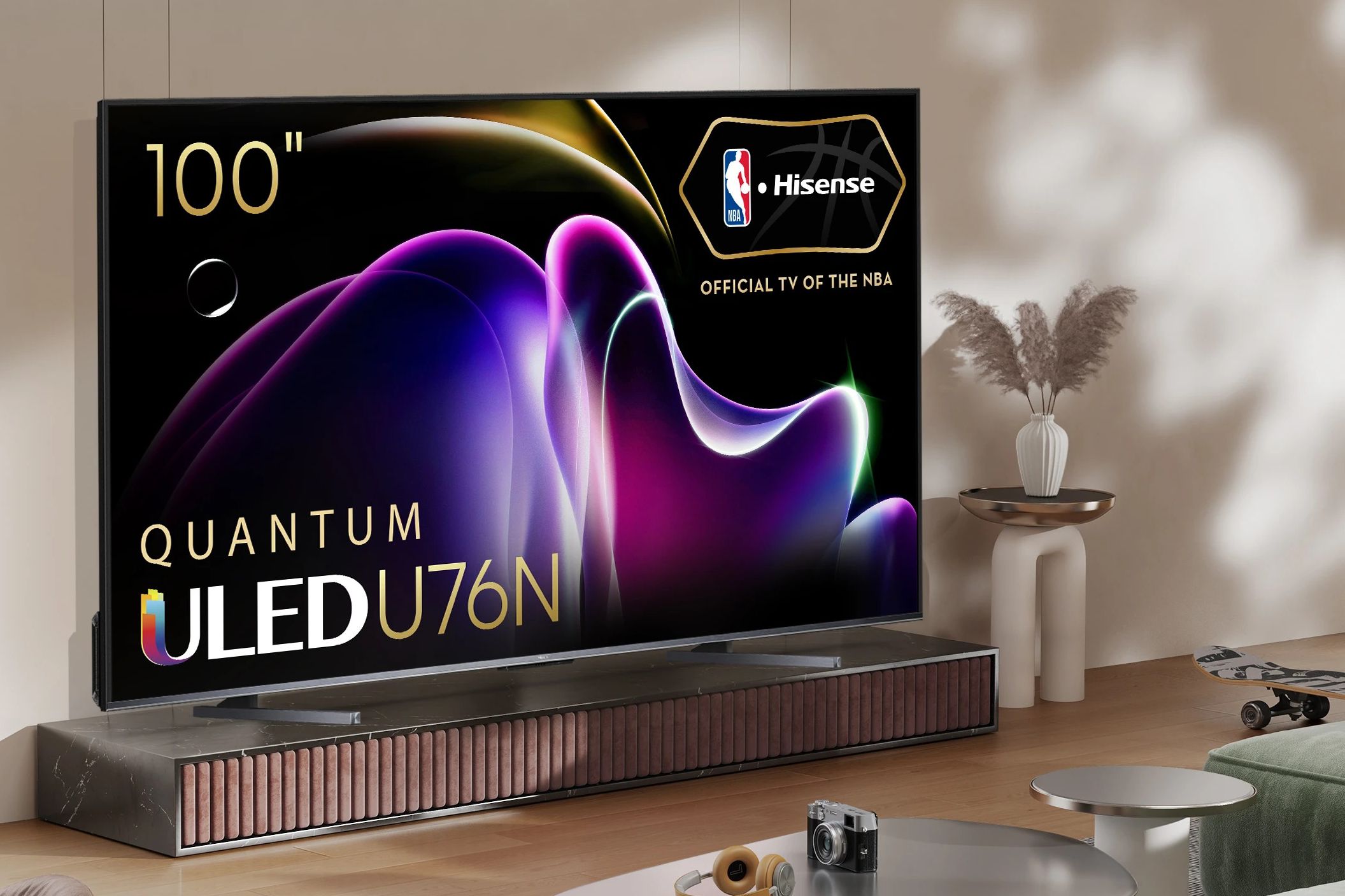The Hisense U76N 100-inch QLED 4K TV on a stand in a living room.