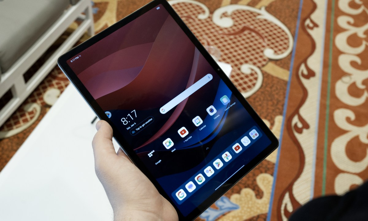 Someone holding the Lenovo Tab M11.