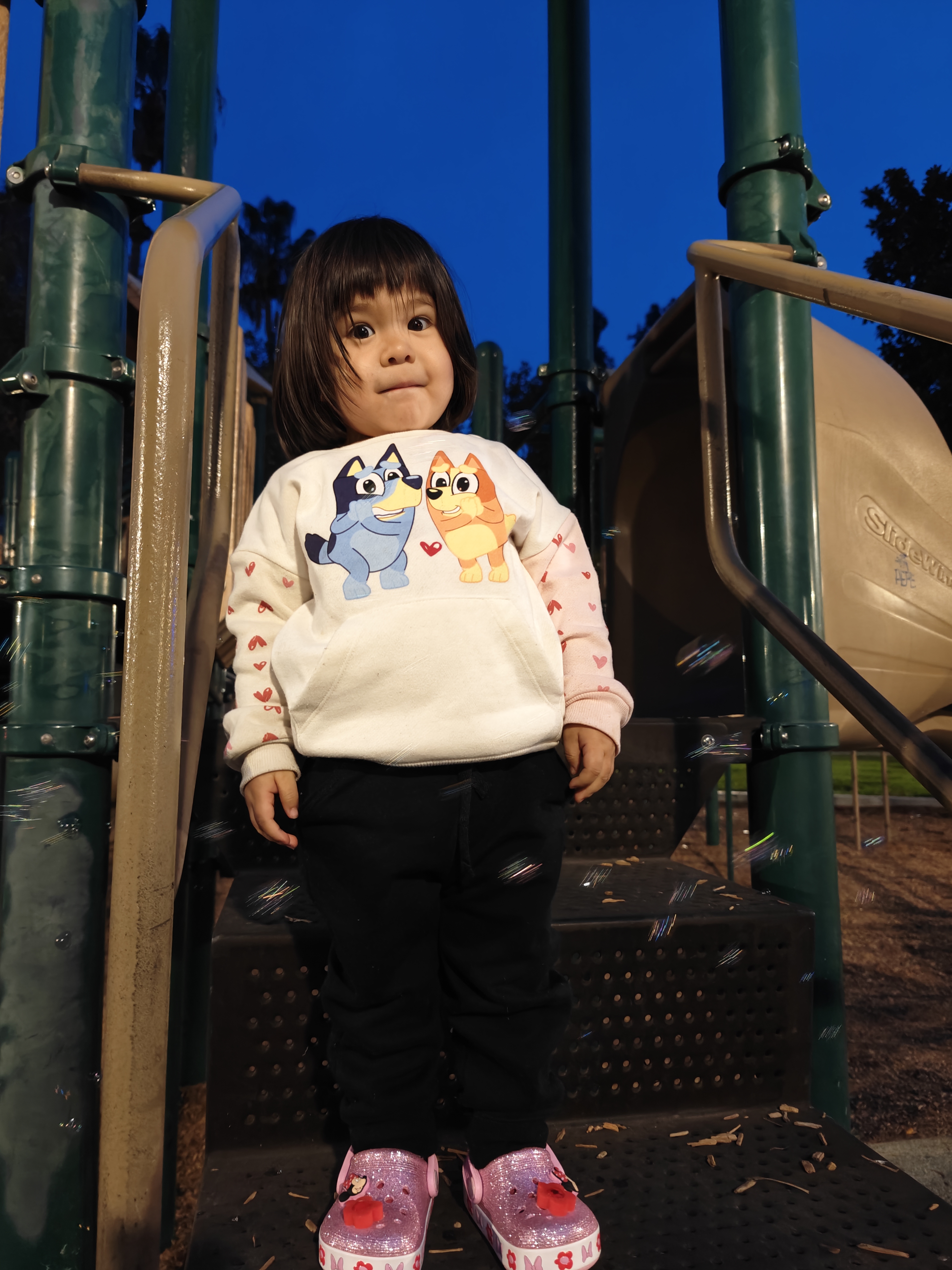 Girl at park taken with OnePlus 12.