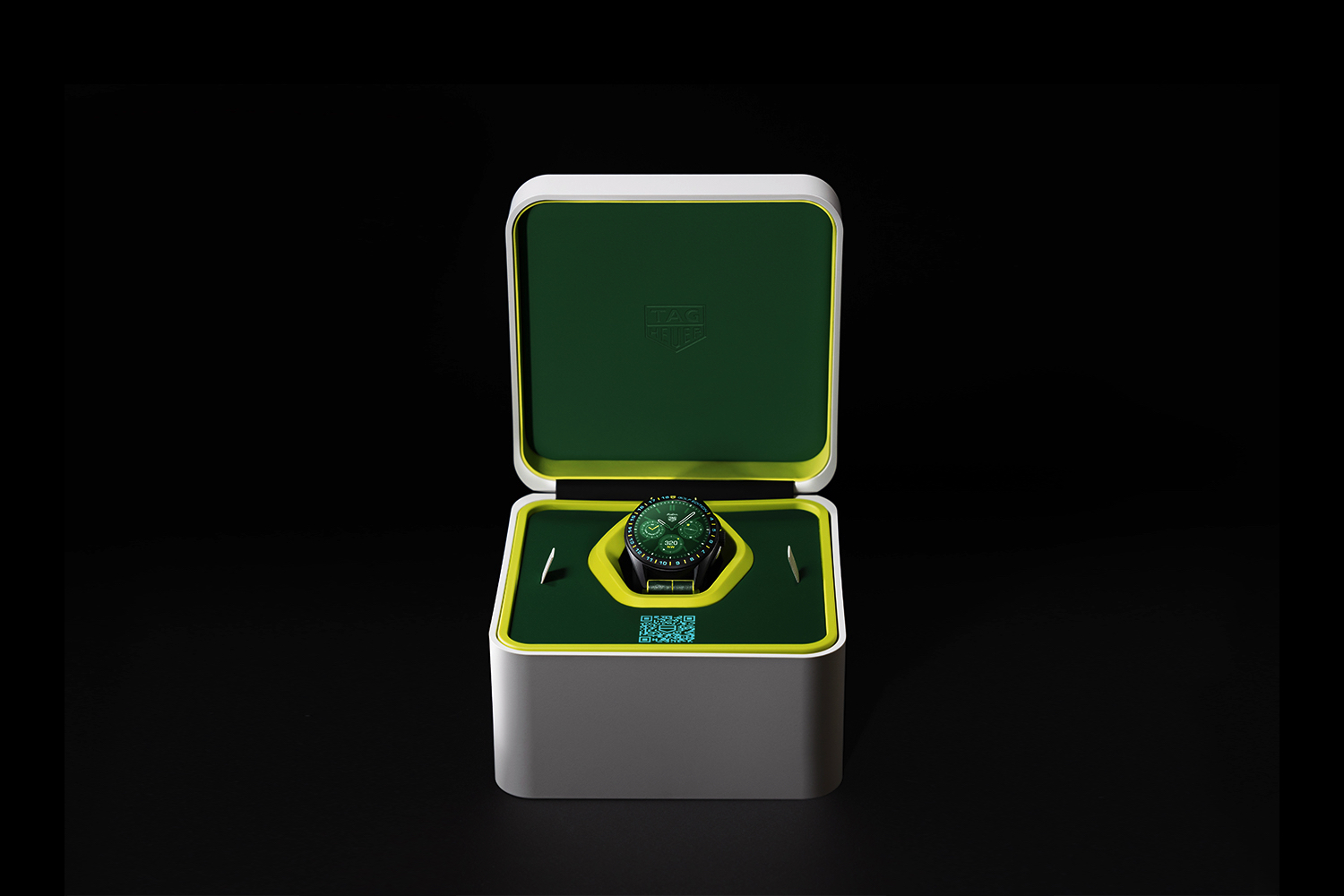 The Tag Heuer Connected Calibre E4 x Malbon Golf watch in its case.